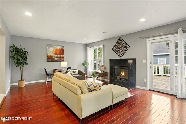 2350 Ariel Cir, Anchorage, AK 99515 - living room with wood finished floors, a fireplace, baseboards, and recessed lighting