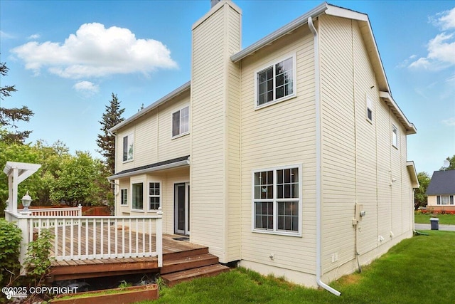 2350 Ariel Cir, Anchorage, AK 99515 - rear view of property with a chimney, a wooden deck, and a yard