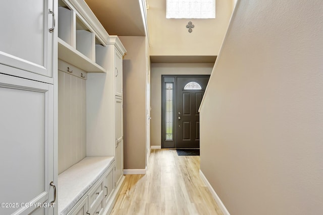 5893 Kenai Fjords Loop, Anchorage, AK 99502 - mudroom with light wood finished floors and baseboards