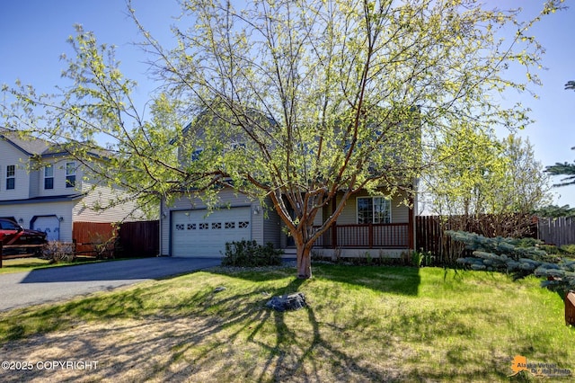 5893 Kenai Fjords Loop, Anchorage, AK 99502 - view of front of house featuring a garage and asphalt driveway