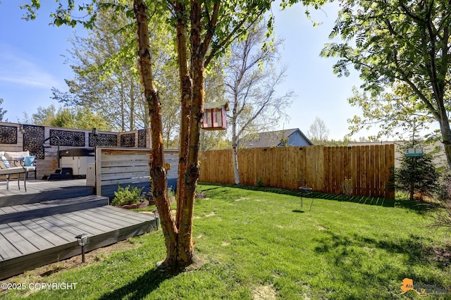 5893 Kenai Fjords Loop, Anchorage, AK 99502 - view of yard with a deck