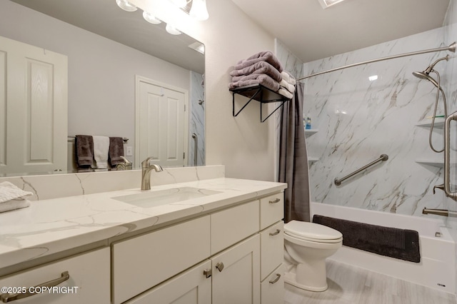 5893 Kenai Fjords Loop, Anchorage, AK 99502 - full bathroom with shower / bath combo, vanity, toilet, and wood finished floors