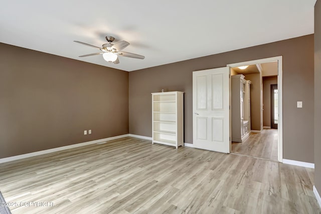 5893 Kenai Fjords Loop, Anchorage, AK 99502 - unfurnished bedroom featuring light wood-type flooring, baseboards, and ceiling fan