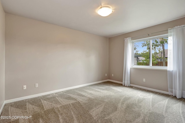 5893 Kenai Fjords Loop, Anchorage, AK 99502 - empty room with baseboards and carpet floors