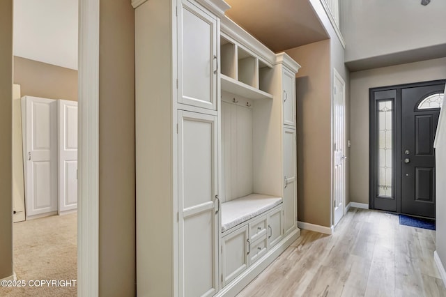 5893 Kenai Fjords Loop, Anchorage, AK 99502 - mudroom with light wood finished floors and baseboards