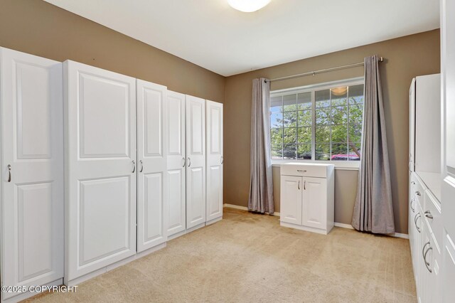 5893 Kenai Fjords Loop, Anchorage, AK 99502 - unfurnished bedroom with light carpet and baseboards