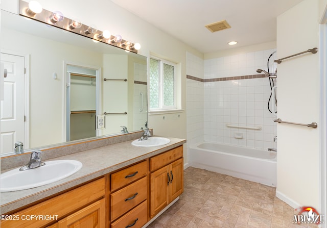 4106 E Country Fair Dr # A, Wasilla, AK 99654 - full bathroom featuring double vanity, shower / tub combination, recessed lighting, and baseboards