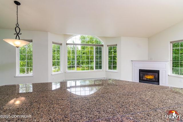 4106 E Country Fair Dr # A, Wasilla, AK 99654 - unfurnished living room featuring a glass covered fireplace