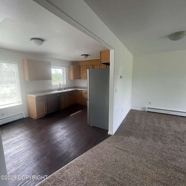 14154 Jojoba Dr, Wasilla, AK 99654 - kitchen featuring freestanding refrigerator, stainless steel dishwasher, a sink, and baseboard heating