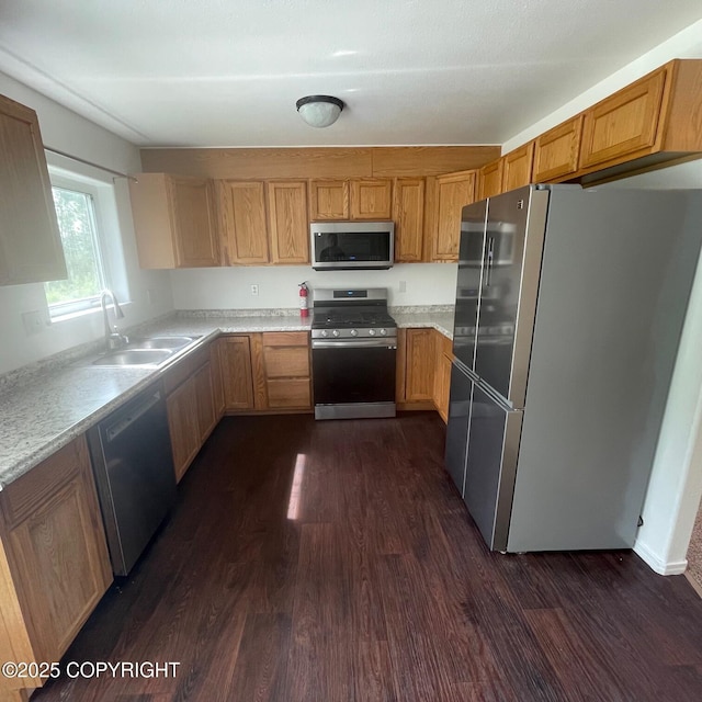 14154 Jojoba Dr, Wasilla, AK 99654 - kitchen with stainless steel appliances, a sink, dark wood finished floors, and light countertops