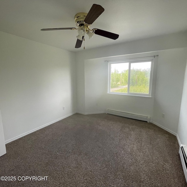 14154 Jojoba Dr, Wasilla, AK 99654 - carpeted spare room featuring a baseboard heating unit, a ceiling fan, and baseboards
