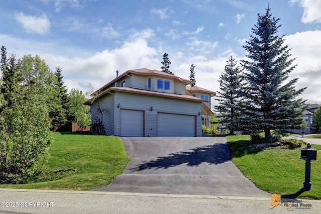 16059 Hidden Creek Ln, Anchorage, AK 99516 - traditional-style house featuring an attached garage and asphalt driveway