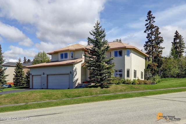 16059 Hidden Creek Ln, Anchorage, AK 99516 - view of front of property featuring asphalt driveway, an attached garage, and a front yard
