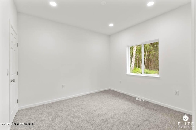 1338 N Unicorn Cir, Palmer, AK 99645 - spare room featuring carpet floors, recessed lighting, and baseboards