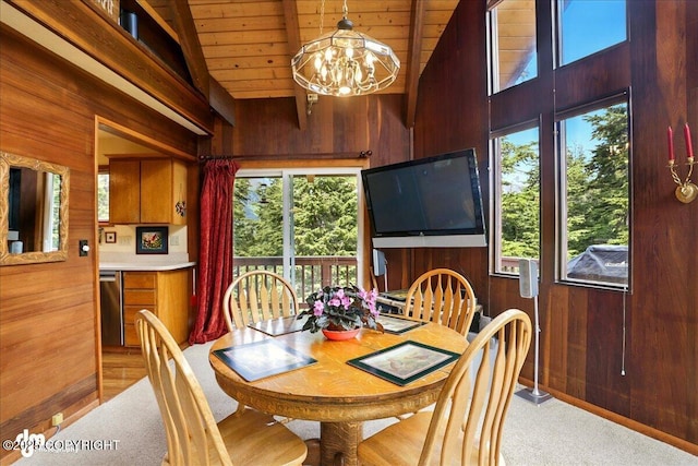 142 Vail Cir, Girdwood, AK 99587 - dining room featuring wood walls, wooden ceiling, a chandelier, light carpet, and high vaulted ceiling