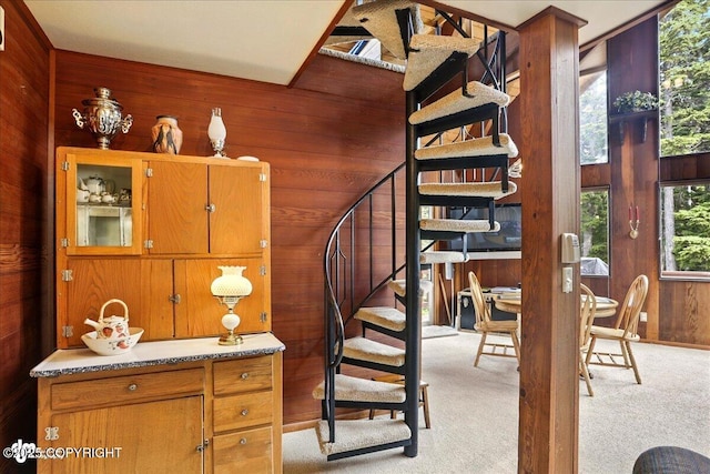 142 Vail Cir, Girdwood, AK 99587 - staircase featuring wood walls and carpet flooring