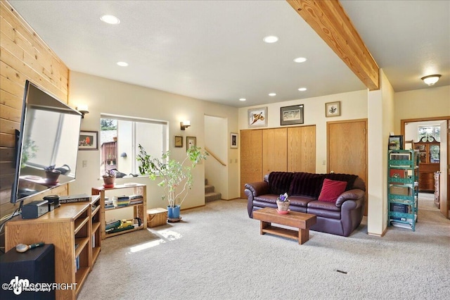 142 Vail Cir, Girdwood, AK 99587 - carpeted living area with healthy amount of natural light, recessed lighting, stairs, and beamed ceiling