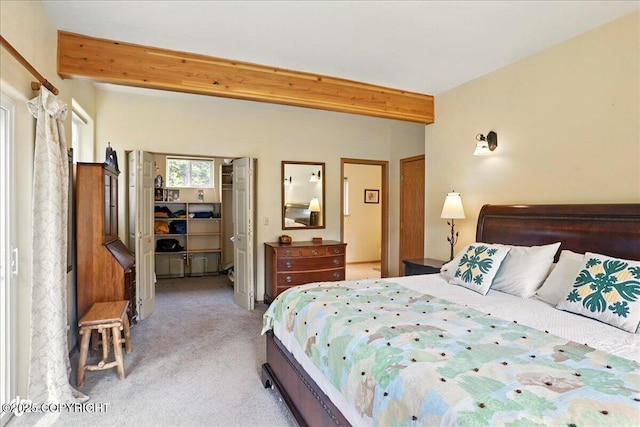 142 Vail Cir, Girdwood, AK 99587 - bedroom with beam ceiling, light colored carpet, a spacious closet, and a closet