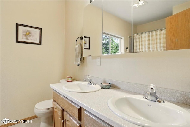 142 Vail Cir, Girdwood, AK 99587 - bathroom with toilet, double vanity, and curtained shower