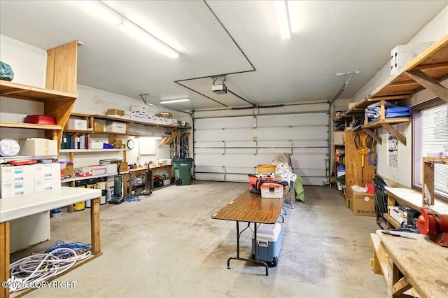 142 Vail Cir, Girdwood, AK 99587 - garage with a workshop area and a garage door opener