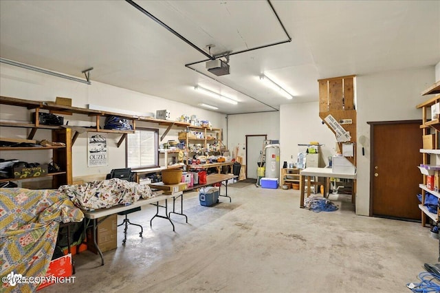 142 Vail Cir, Girdwood, AK 99587 - garage with a garage door opener, a workshop area, and water heater
