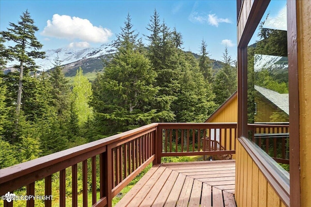 142 Vail Cir, Girdwood, AK 99587 - deck featuring a mountain view and a wooded view