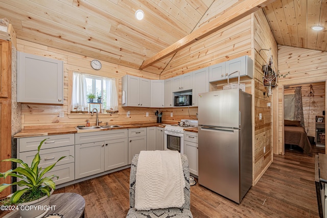 36733 Pavilion Dr, Soldotna, AK 99669 - kitchen featuring freestanding refrigerator, black microwave, wood counters, wood ceiling, and wood walls