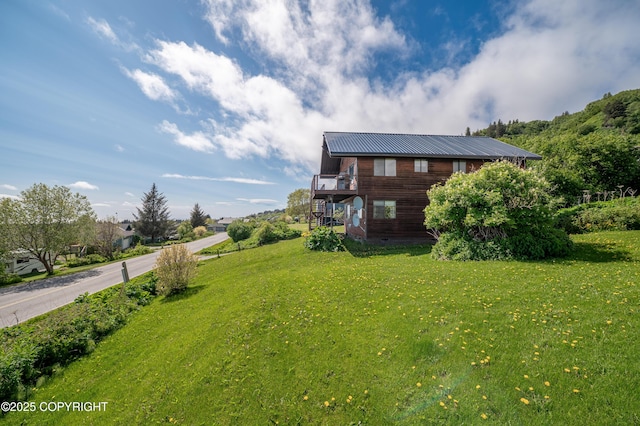 292 Mountain View Dr, Homer, AK 99603 - view of home's exterior featuring a yard and a metal roof