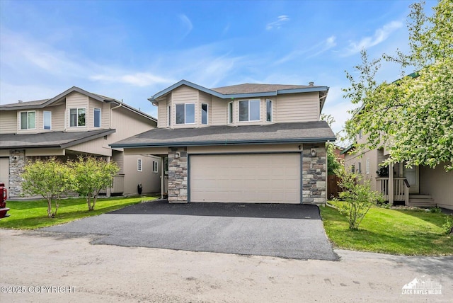 268 Dailey Ave, Anchorage, AK 99515 - view of front facade featuring stone siding, a garage, driveway, and a front yard