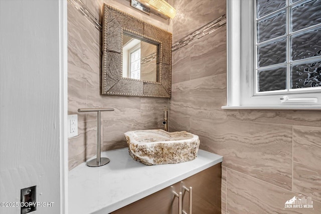 268 Dailey Ave, Anchorage, AK 99515 - bathroom featuring vanity and tile walls