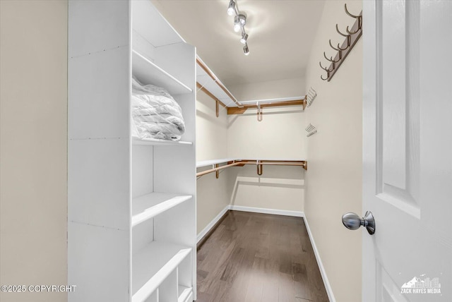 268 Dailey Ave, Anchorage, AK 99515 - walk in closet featuring wood finished floors