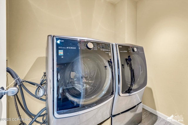 268 Dailey Ave, Anchorage, AK 99515 - laundry area with washer and dryer and baseboards