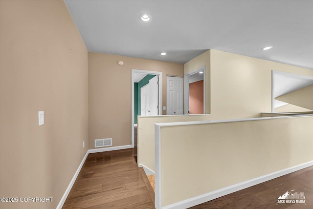 268 Dailey Ave, Anchorage, AK 99515 - hall with baseboards, wood finished floors, and recessed lighting