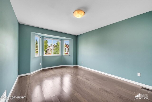 268 Dailey Ave, Anchorage, AK 99515 - unfurnished room featuring wood finished floors and baseboards