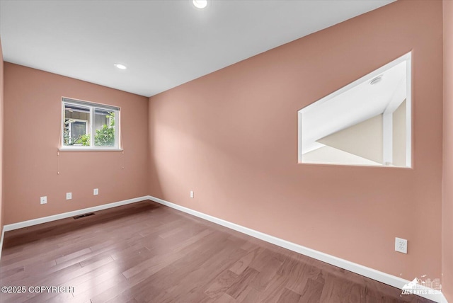 268 Dailey Ave, Anchorage, AK 99515 - unfurnished room featuring baseboards, wood finished floors, and recessed lighting