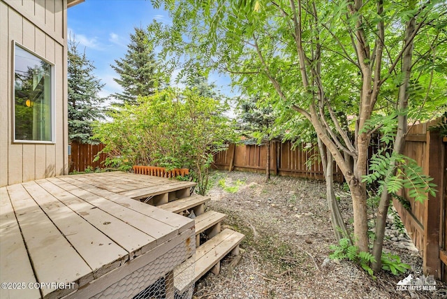 268 Dailey Ave, Anchorage, AK 99515 - fenced backyard featuring a deck