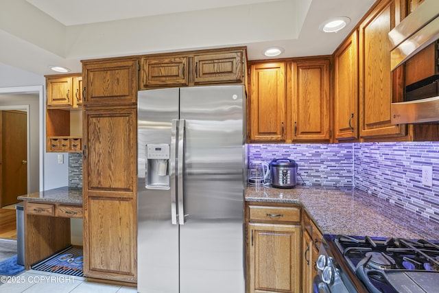 11751 Mary Ave, Anchorage, AK 99515 - kitchen featuring stainless steel appliances, decorative backsplash, brown cabinetry, and recessed lighting