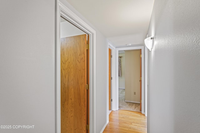 11751 Mary Ave, Anchorage, AK 99515 - corridor with light wood-style flooring and baseboards