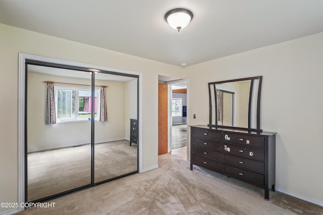11751 Mary Ave, Anchorage, AK 99515 - bedroom featuring light carpet and a closet