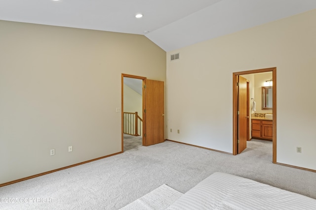 11751 Mary Ave, Anchorage, AK 99515 - unfurnished bedroom featuring light carpet, vaulted ceiling, recessed lighting, and ensuite bathroom