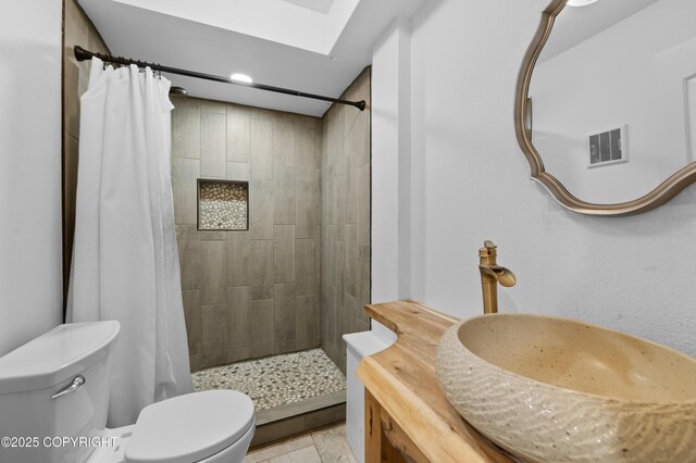 1855 Mission Rd, Homer, AK 99603 - full bathroom with a tile shower, vanity, and recessed lighting