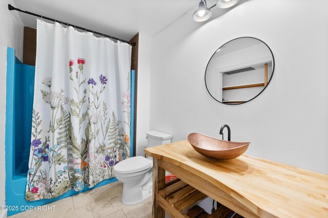 1855 Mission Rd, Homer, AK 99603 - bathroom featuring vanity, a shower with shower curtain, and tile patterned flooring