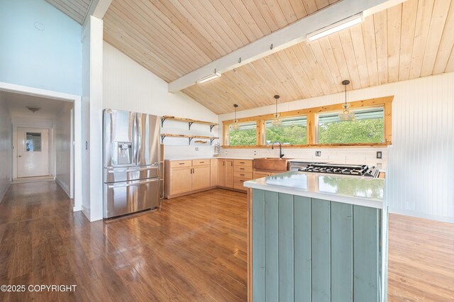 1855 Mission Rd, Homer, AK 99603 - kitchen with stainless steel fridge with ice dispenser, light countertops, dark wood-type flooring, open shelves, and a wood ceiling with exposed beams
