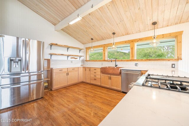1855 Mission Rd, Homer, AK 99603 - kitchen featuring appliances with stainless steel finishes, light wood-style floors, backsplash, hanging light fixtures, and wooden ceiling