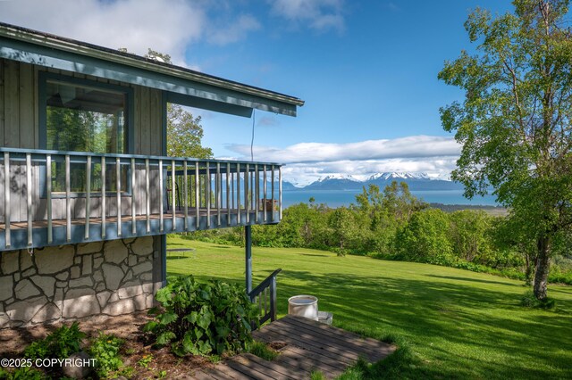 1855 Mission Rd, Homer, AK 99603 - view of green lawn with a deck with mountain view