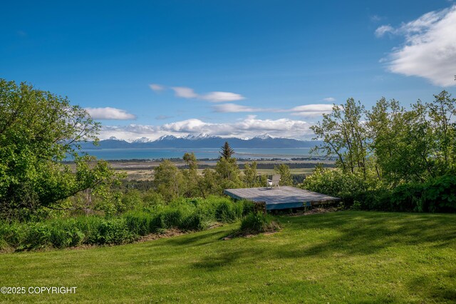 1855 Mission Rd, Homer, AK 99603 - view of grassy yard featuring a deck with mountain view