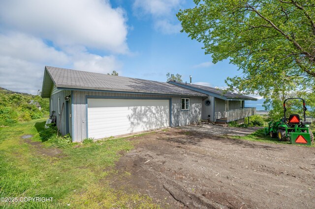 1855 Mission Rd, Homer, AK 99603 - view of front facade with dirt driveway and an attached garage