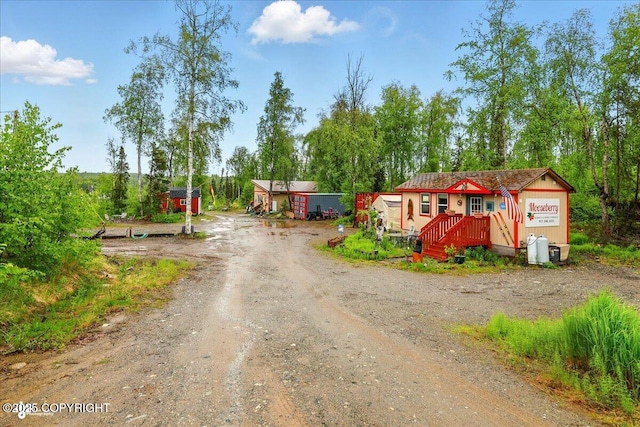 9637 N Buckingham Palace Rd, Willow, AK 99688 - view of dirt / gravel driveway featuring view of scattered trees