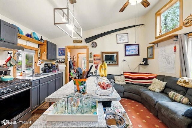 9637 N Buckingham Palace Rd, Willow, AK 99688 - kitchen with stainless steel gas range oven, a sink, open floor plan, ceiling fan, and extractor fan