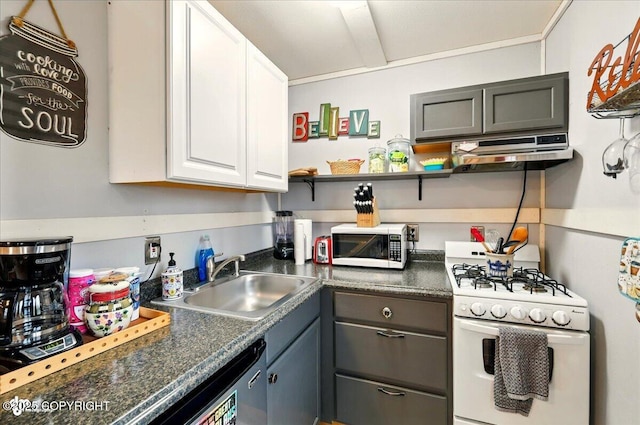 9637 N Buckingham Palace Rd, Willow, AK 99688 - kitchen featuring white range with gas cooktop, stainless steel microwave, a sink, dark countertops, and white cabinetry